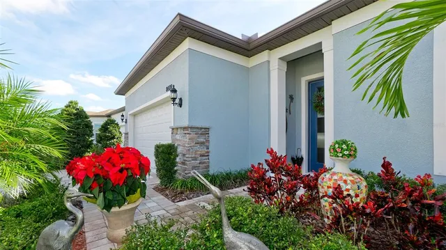 a view of a workspace with furniture and a flat screen tv
