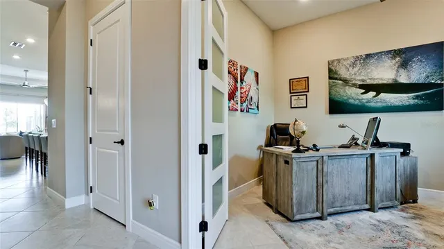a large kitchen with a table and chairs