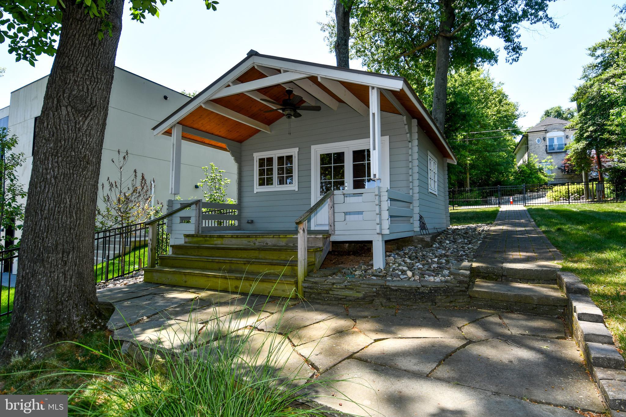 7808 Southdown Road Alexandria, VA 22308 - Photo 6 of 99 a front view of a house with a yard