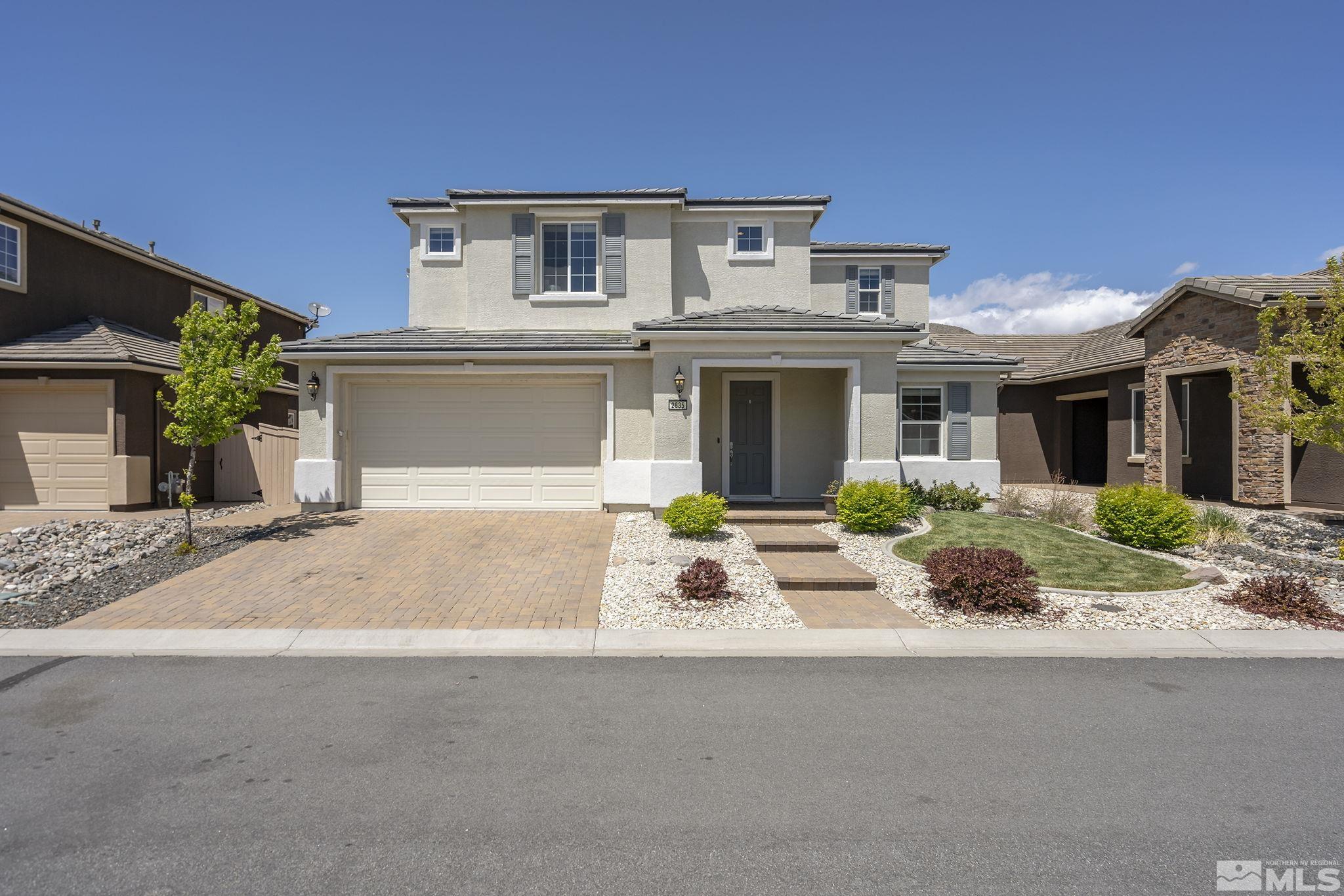 2835 Bonfire Lane Reno, NV 89521 - Photo 1 of 28 a front view of a house with yard and seating space