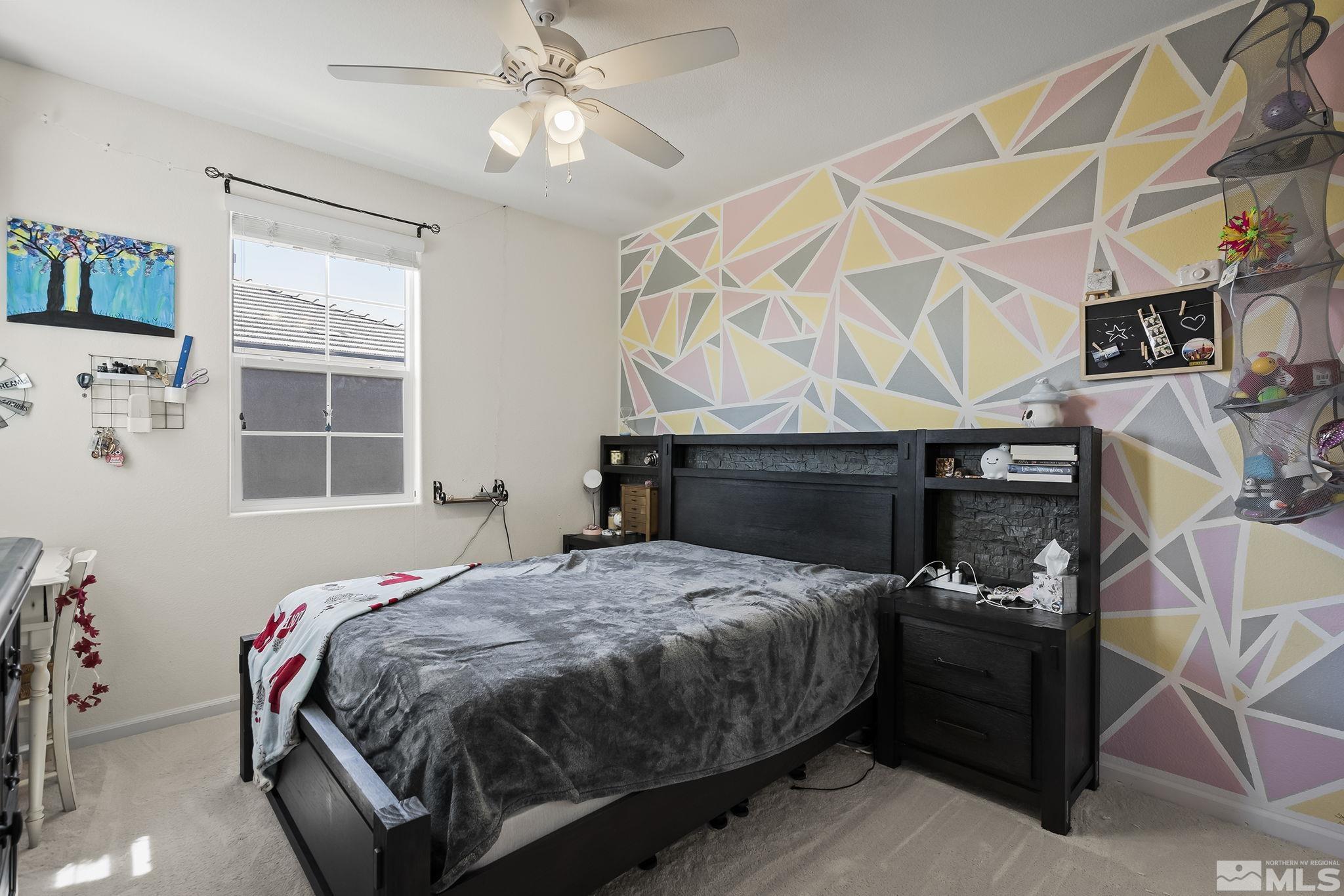 2835 Bonfire Lane Reno, NV 89521 - Photo 18 of 28 a bedroom with a bed and wooden floor