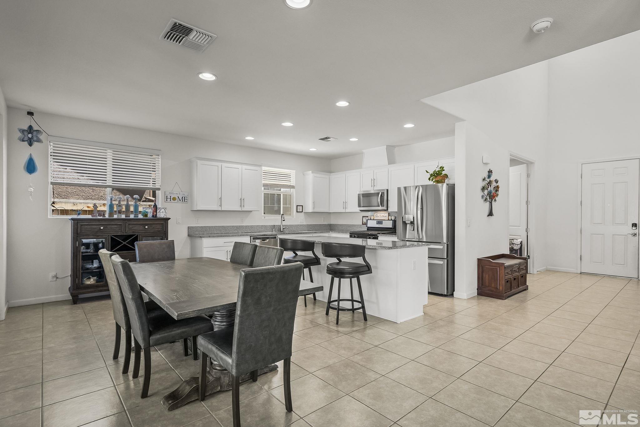 2835 Bonfire Lane Reno, NV 89521 - Photo 3 of 28 a view of kitchen with refrigerator and furniture