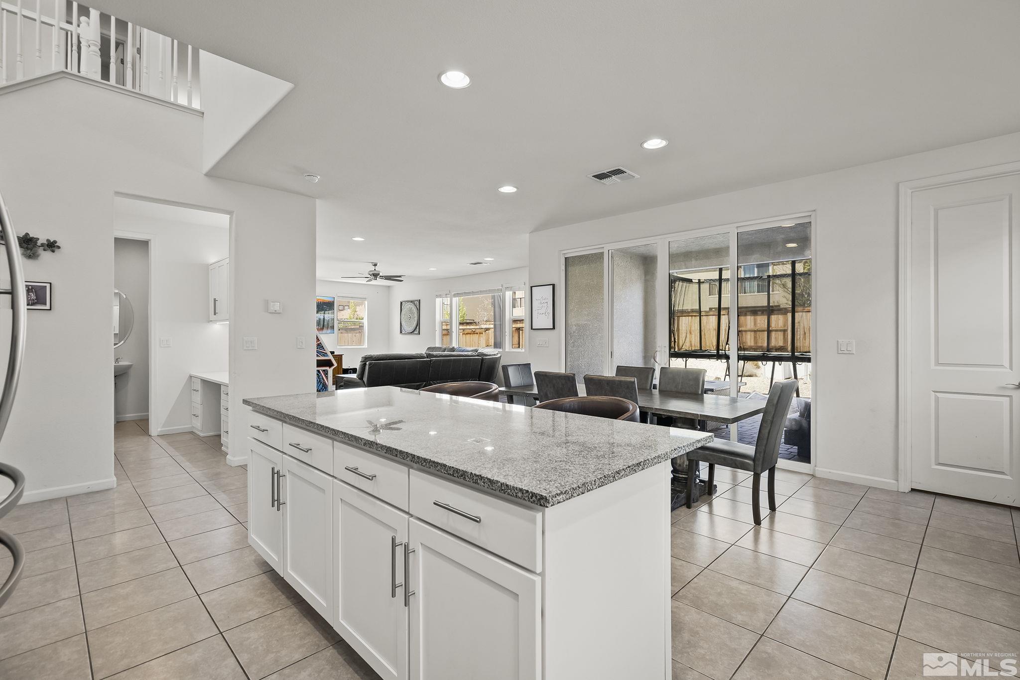 2835 Bonfire Lane Reno, NV 89521 - Photo 8 of 28 a dining hall with stainless steel appliances granite countertop a granite counter tops and a view of living room