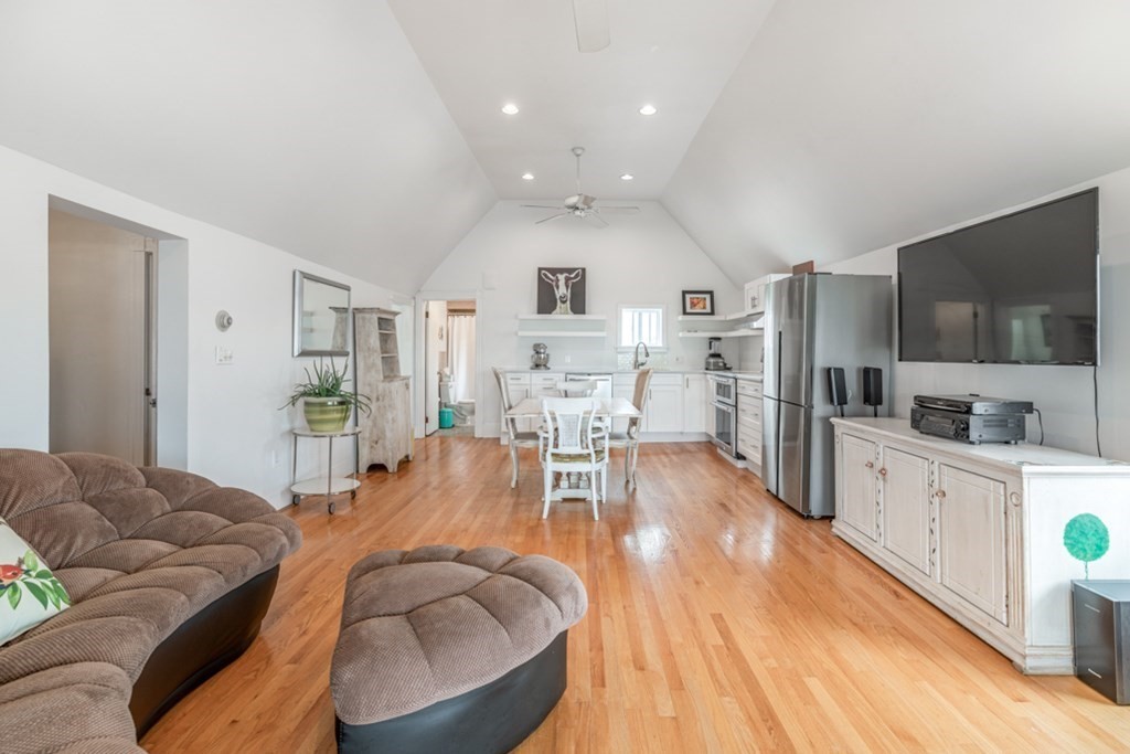 106 Upland Road Winthrop, MA 02152 - Photo 14 of 37 a living room with furniture and a flat screen tv