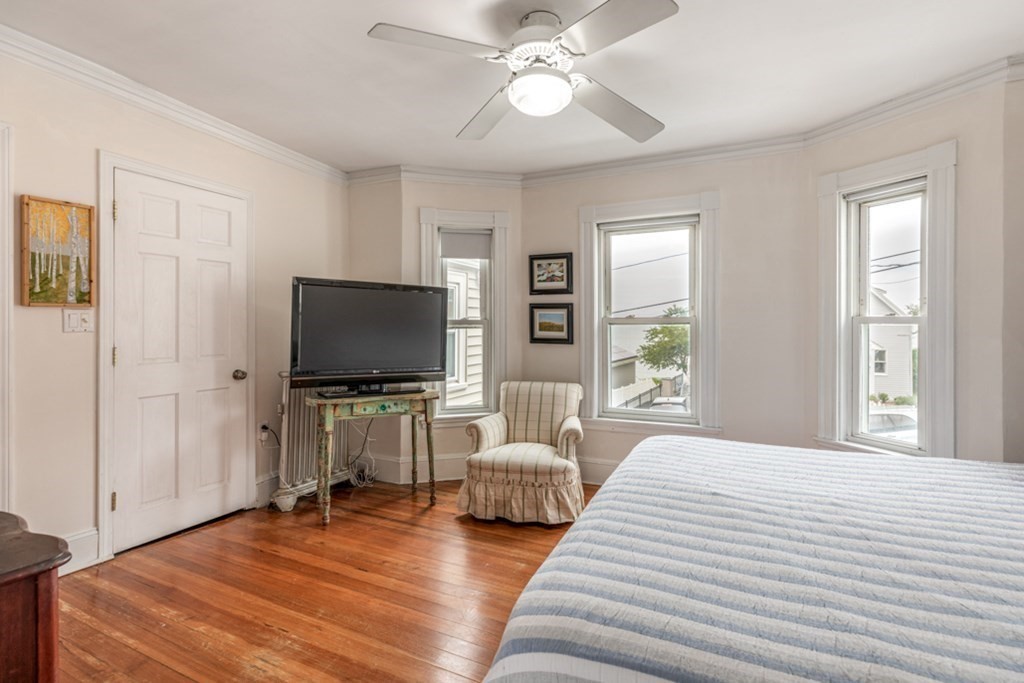 106 Upland Road Winthrop, MA 02152 - Photo 16 of 37 a bedroom with a bed and a flat screen tv