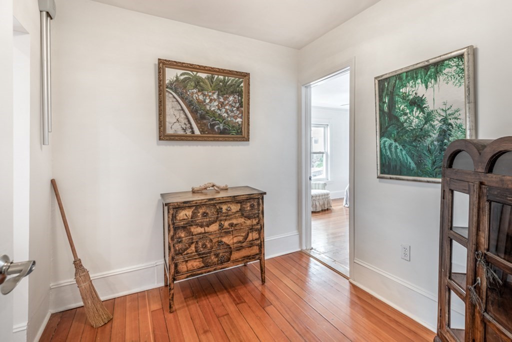 106 Upland Road Winthrop, MA 02152 - Photo 19 of 37 a view of an empty room with wooden floor and a window