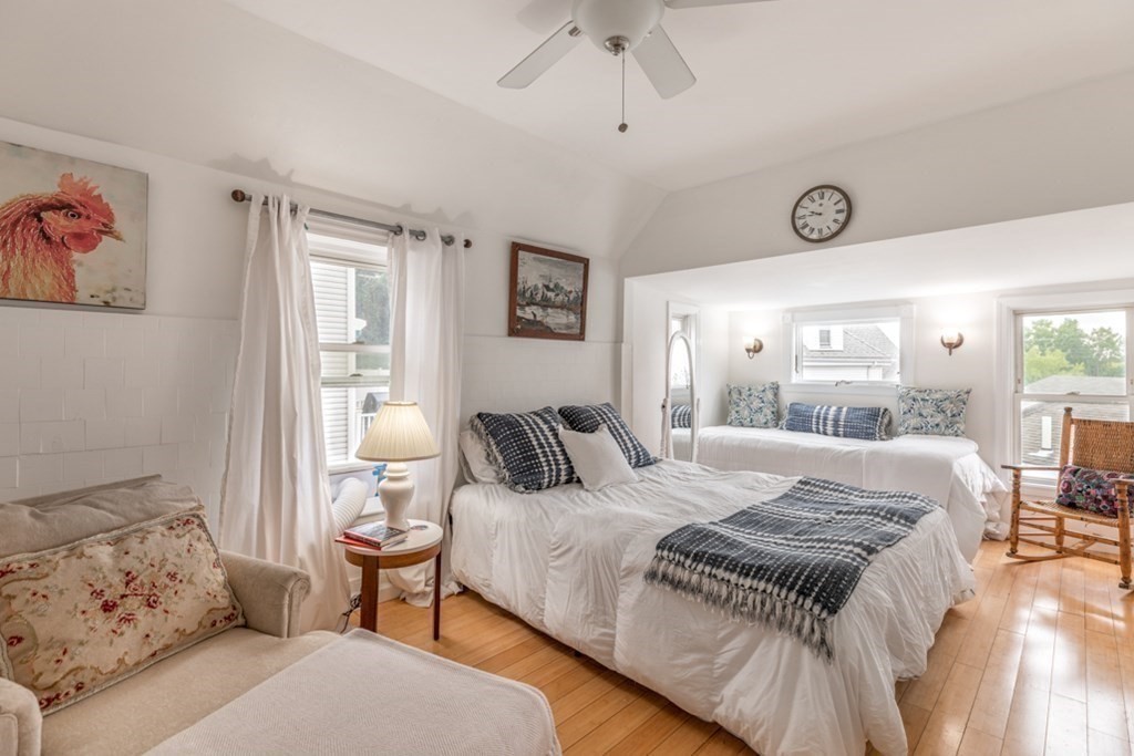 106 Upland Road Winthrop, MA 02152 - Photo 20 of 37 a bedroom with a bed and wooden floor