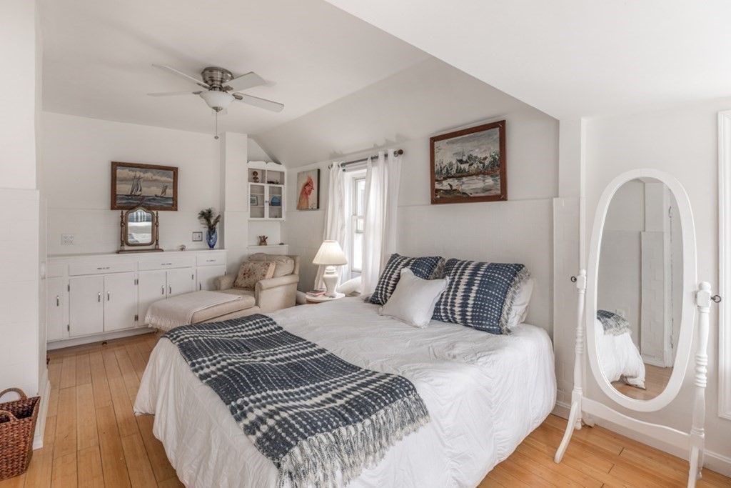 106 Upland Road Winthrop, MA 02152 - Photo 21 of 37 a bedroom with bed and wooden floor