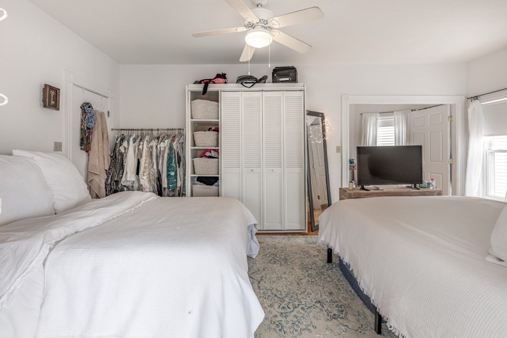 106 Upland Road Winthrop, MA 02152 - Photo 29 of 37 a bedroom with a bed and a flat screen tv