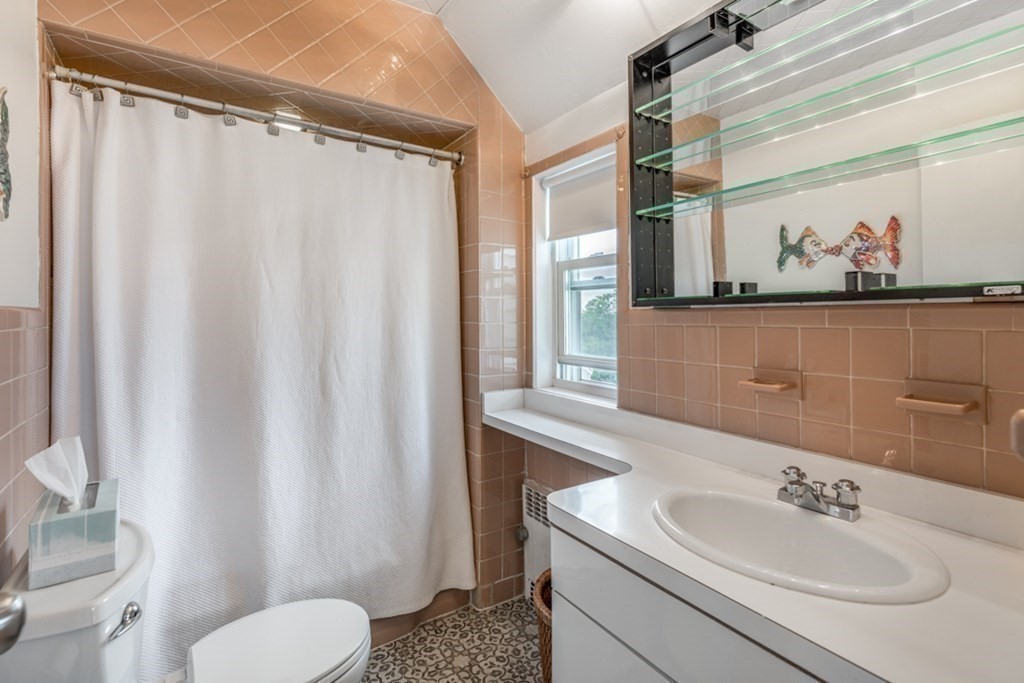 106 Upland Road Winthrop, MA 02152 - Photo 31 of 37 a bathroom with a sink toilet and shower