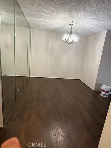 a view of room with wooden floor