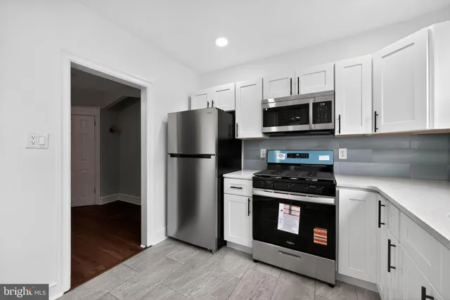 a kitchen with a stove microwave and refrigerator