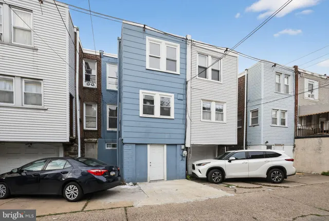 a car parked in front of a house