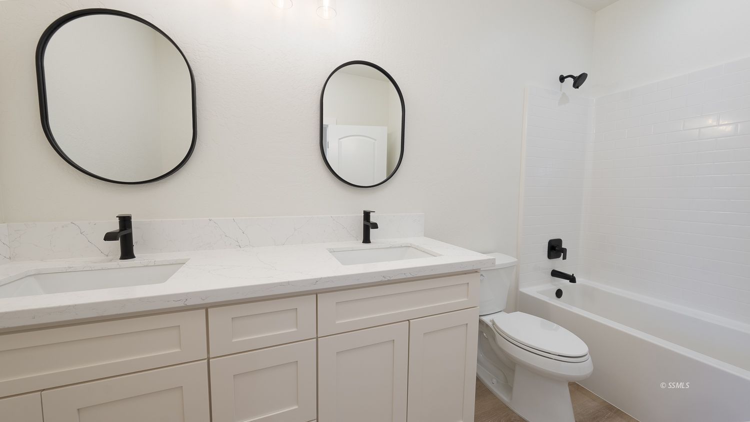 1528 Mayo Street Ridgecrest, CA 93555 - Photo 27 of 34 a bathroom with a sink a toilet and a mirror