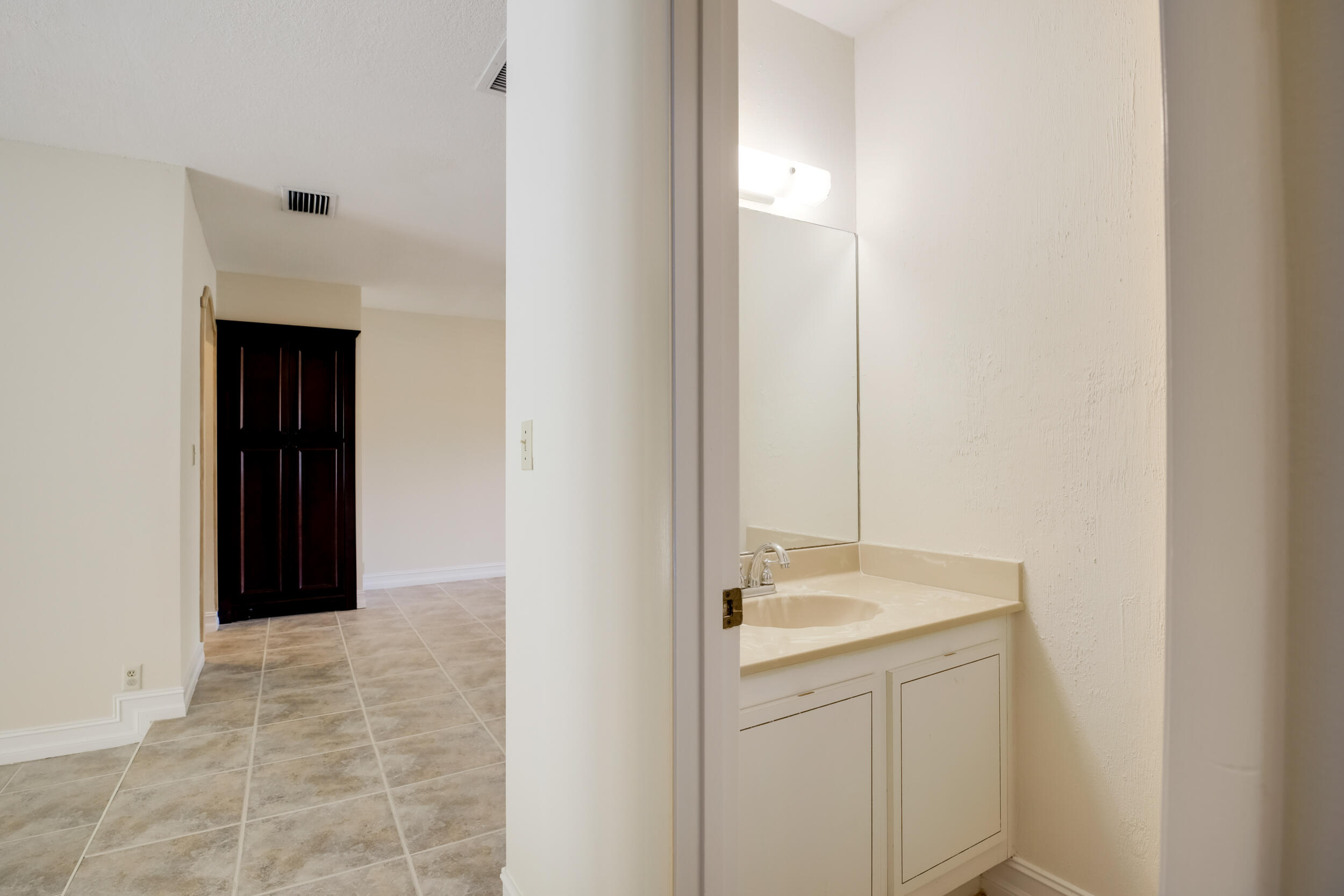 21243 Escondido Way North Boca Raton, FL 33433 - Photo 23 of 42 Half bath off hallway