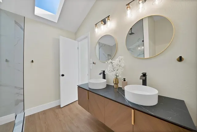 a bathroom with a sink and a mirror