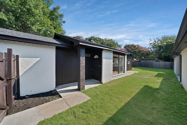 a backyard of a house with seating space