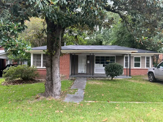 front view of a house with a yard
