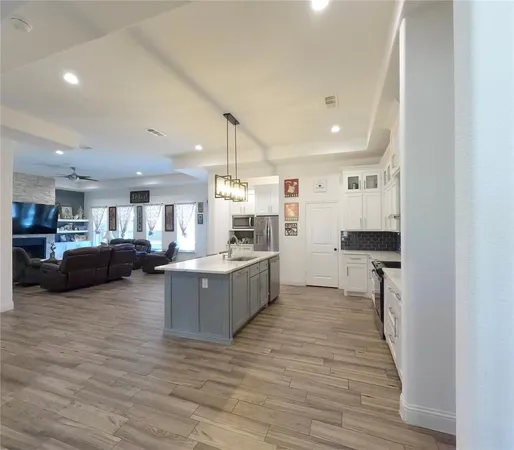 a kitchen with lots of counter top space and a window