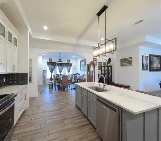 a kitchen with sink and stove