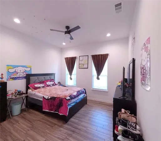 a bed room with a bed and a tv
