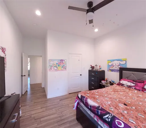 a bathroom with a bath tub a sink and a mirror