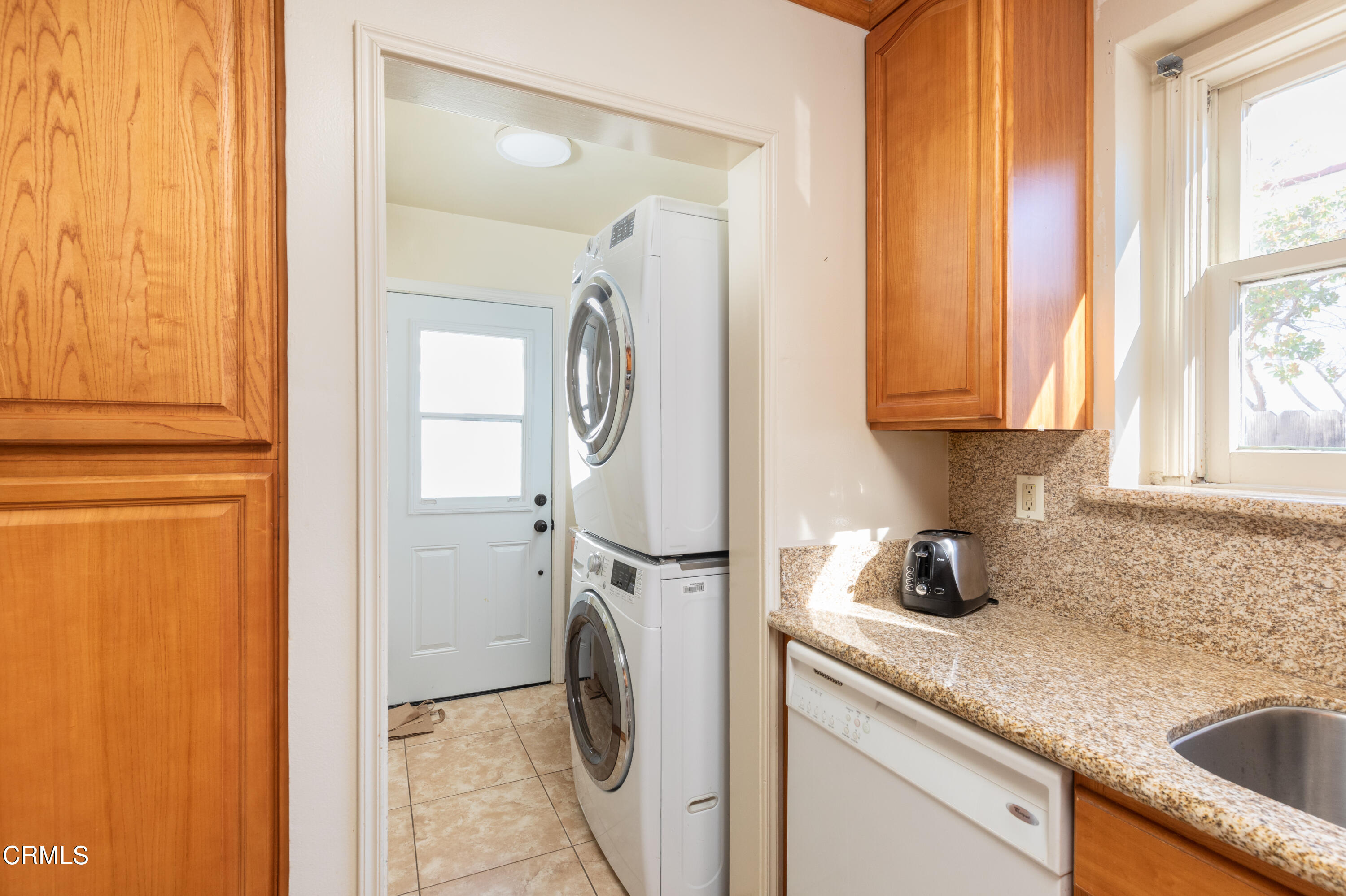 1539 Broadview Drive Glendale, CA 91208 - Photo 11 of 19 a kitchen with a sink a washer and dryer next to a window