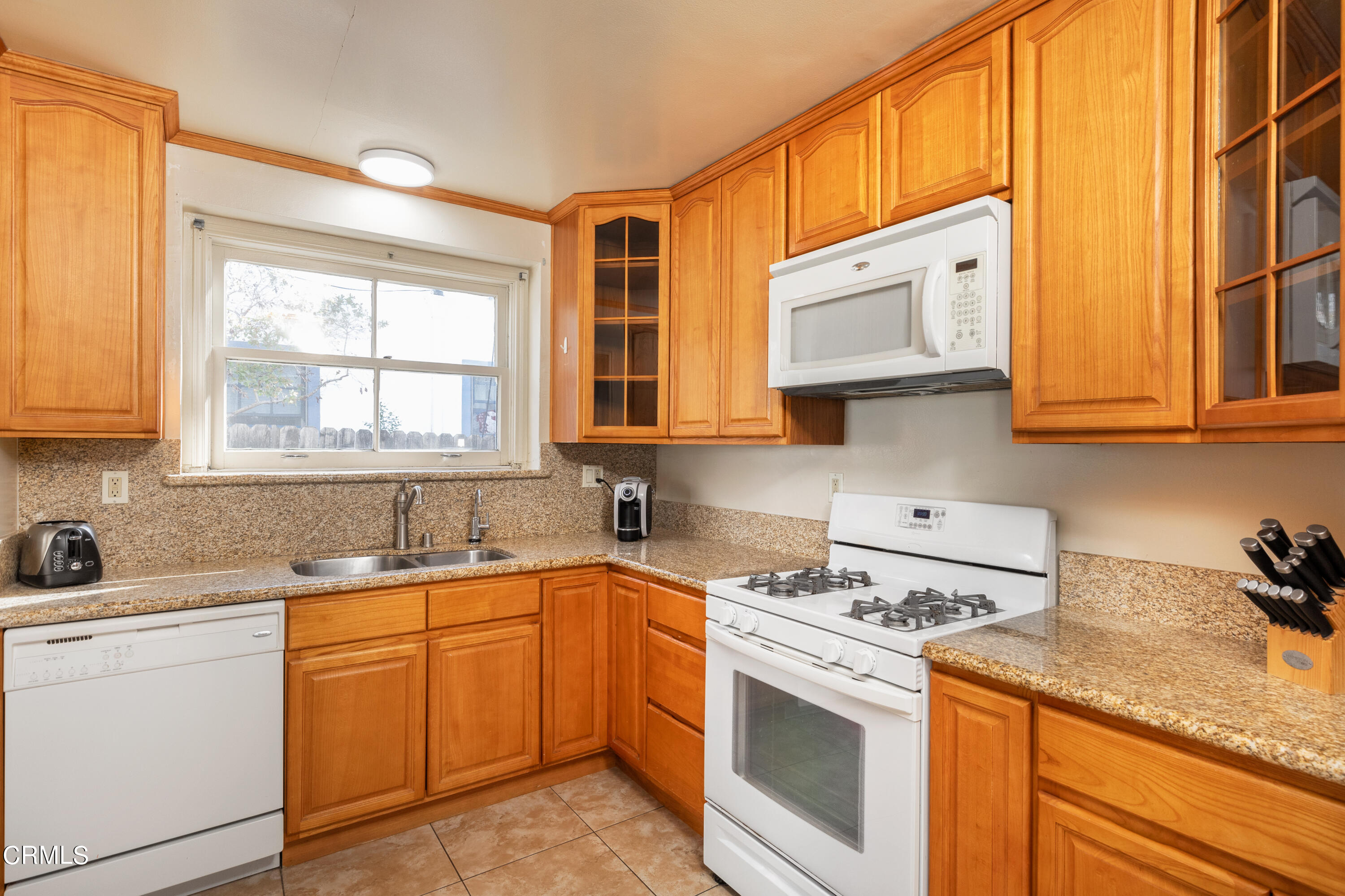 1539 Broadview Drive Glendale, CA 91208 - Photo 8 of 19 a kitchen with stainless steel appliances granite countertop a sink a stove and cabinets
