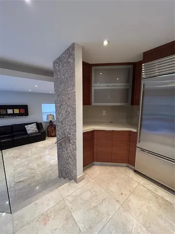 a view of an empty room with a fireplace