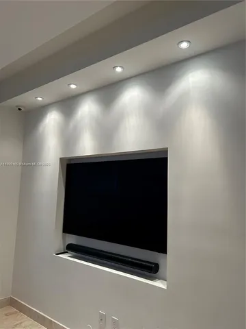 a bathroom with double sink and a mirror