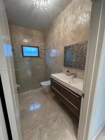 a view of backyard with patio and outdoor seating