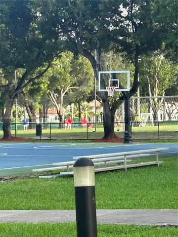 a living room with furniture floor to ceiling window and floor to ceiling window