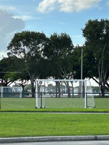 a view of a dining room with furniture wooden floor and chandelier