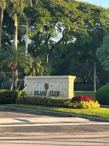 a sign broad on a brick wall