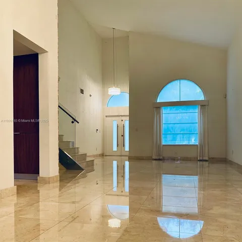 a view of staircase with white walls