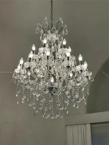 a view of kitchen with stainless steel appliances granite countertop sink and cabinets