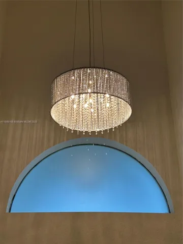 a kitchen with stainless steel appliances kitchen island granite countertop a refrigerator and a sink