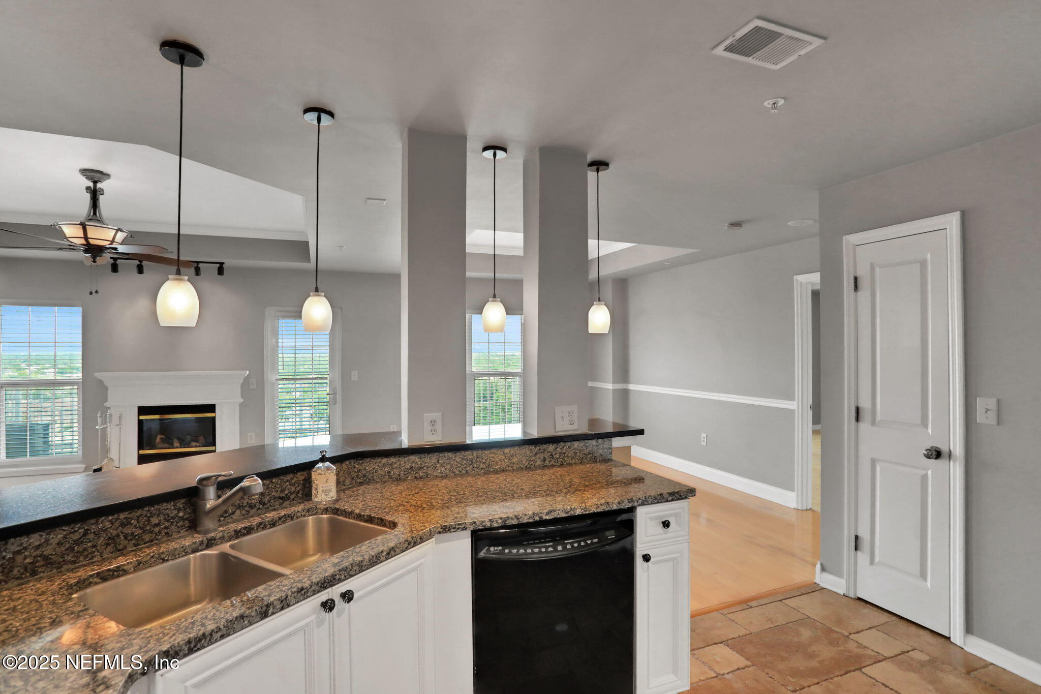 400 East Bay Street, Unit 1705 Jacksonville, FL 32202 - Photo 12 of 68 a kitchen with granite countertop a sink a counter top space and cabinets