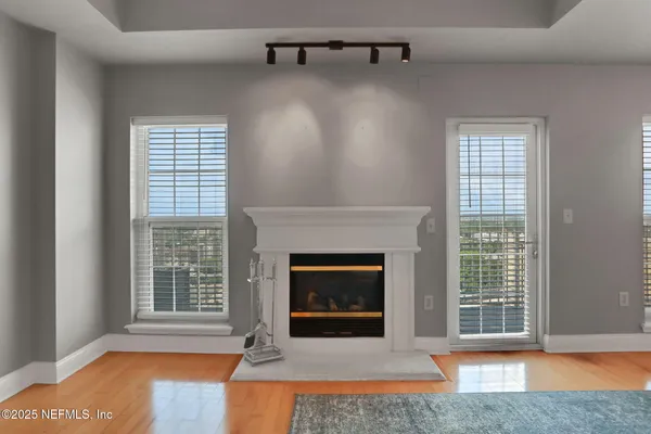 a view of an empty room with a chandelier