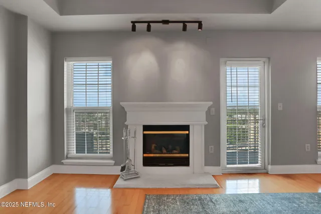 a view of an empty room with a chandelier