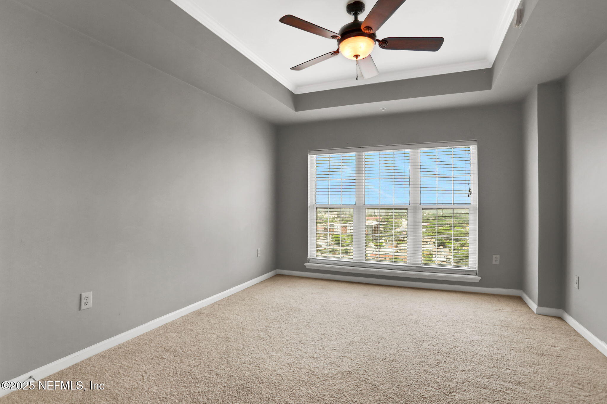 400 East Bay Street, Unit 1705 Jacksonville, FL 32202 - Photo 29 of 68 an empty room with a window and a fan