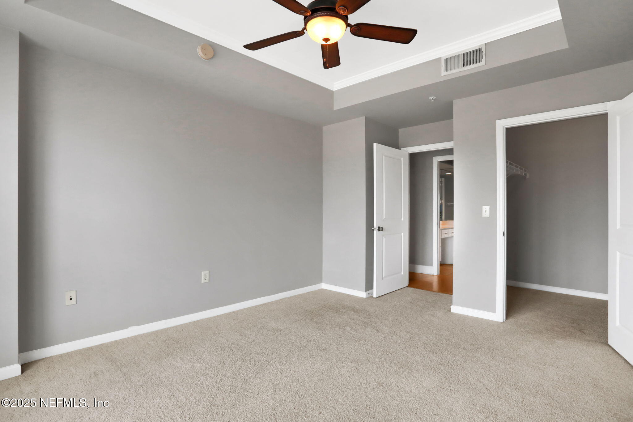 400 East Bay Street, Unit 1705 Jacksonville, FL 32202 - Photo 30 of 68 an empty room with chandelier fan