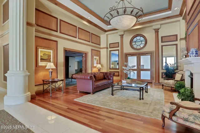 a living room with furniture or couch and a potted plant