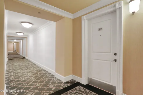 a view of a tennis ground with large buildings