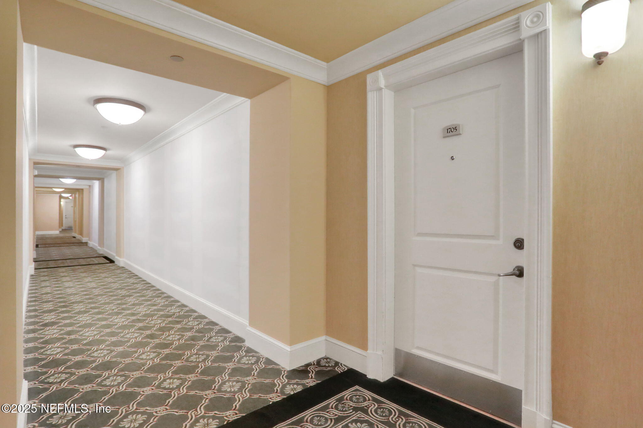 400 East Bay Street, Unit 1705 Jacksonville, FL 32202 - Photo 48 of 68 a view of a hallway with wooden floor and a bathroom