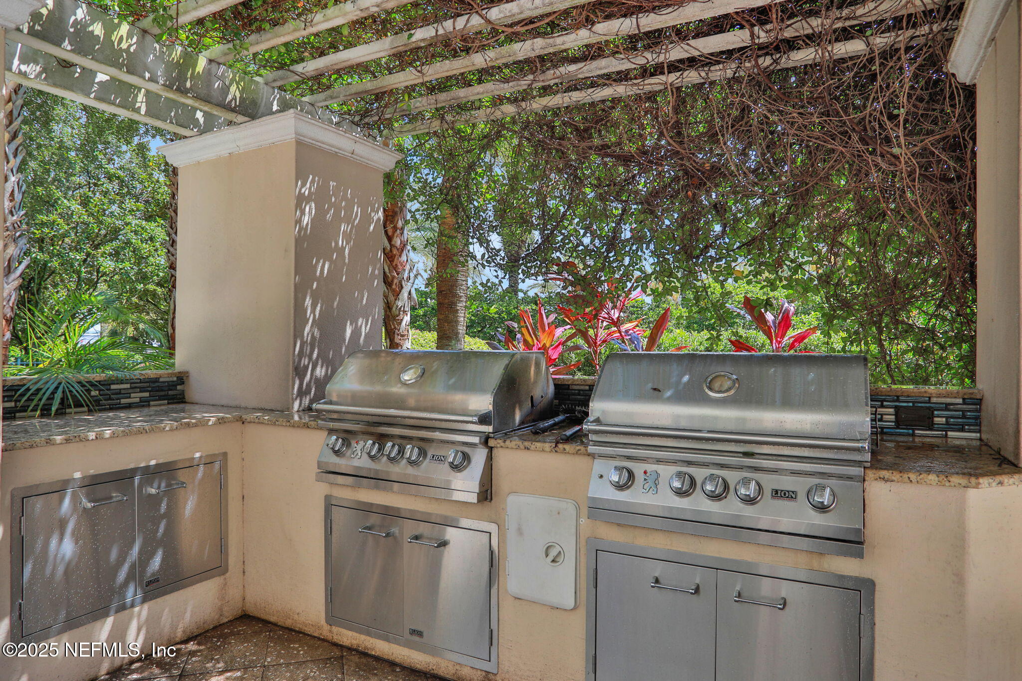 400 East Bay Street, Unit 1705 Jacksonville, FL 32202 - Photo 53 of 68 a stove top oven sitting inside of a kitchen