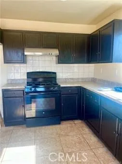 a kitchen with stainless steel appliances granite countertop a stove and a sink