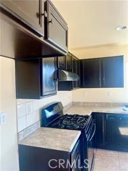 a kitchen with a stove and a cabinets