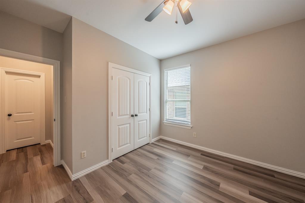 412 Hideaway Road McKinney, TX 75072 - Photo 27 of 40 wooden floor in an empty room with a window