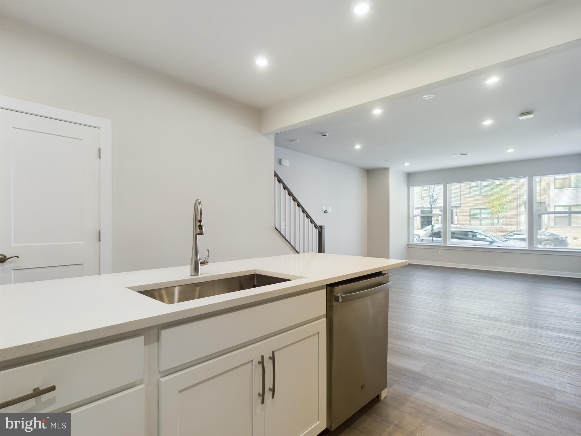 43801 Middleway Terrace Ashburn, VA 20147 - Photo 16 of 54 a kitchen with a sink and wooden floor